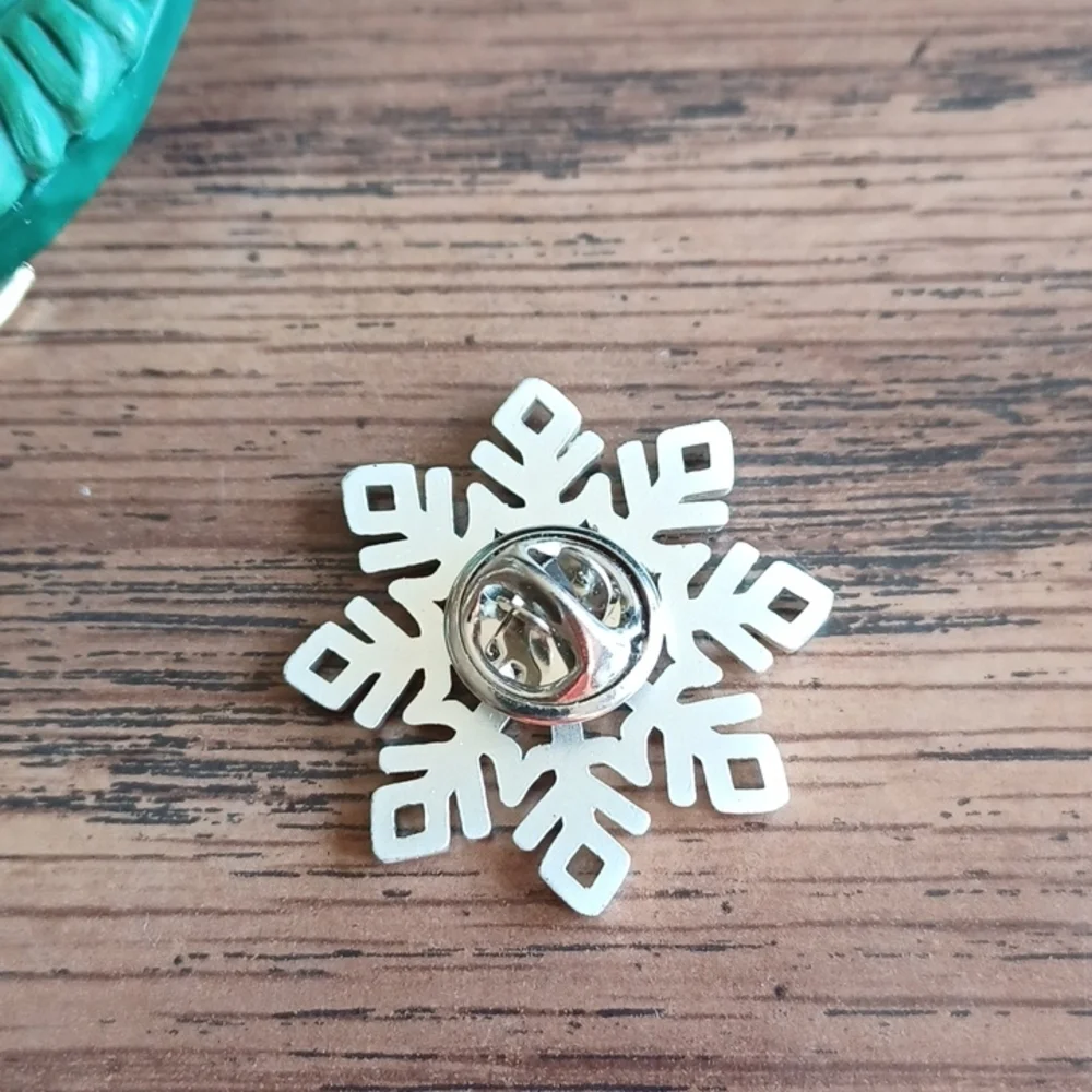 Snowflake pin, aluminum look, rhinestone center, approx 1